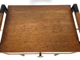 a small wooden tray with a handle on it