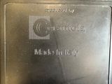 a close up of a metal plate with a name on it