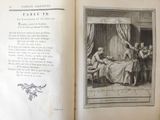 an open book with a picture of a woman sitting at a table
