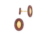 two pairs of red and gold stud earrings on a white background