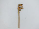 an old wooden stick with a decorative design on it