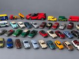 a lot of toy cars that are on the table