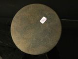 a round table with a sticker on the top of it