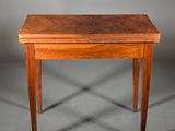 a small table with a wooden top and legs