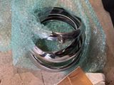 a close up of a sink faucet with a glass covering it