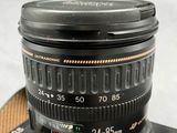 a camera lens sitting on top of a camera case