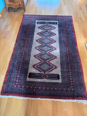 a rug on the floor in a living room