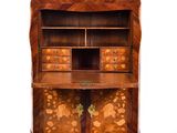 an old wooden bureau with drawers and drawers on top