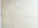 a piece of paper on a table next to a cup of coffee