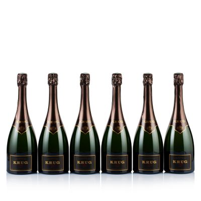 six bottles of champagne lined up in a row