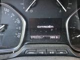 a close up of a car dashboard with a clock on it