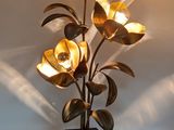 a lamp that has a bunch of flowers on it