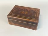 an image of a wooden box with a monogram on it