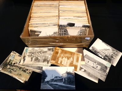 a lot of old photos in a box on the table