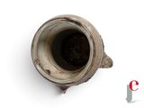 a small cup that is sitting on a white surface