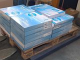 several stacks of blue boxes on top of a pallet in a warehouse