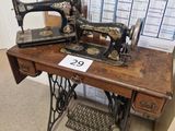 a sewing machine sitting on a table with a calendar on it