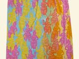 the skirt is multicolored and has a pattern of flowers on it