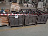 many boxes of assorted metal items in a warehouse