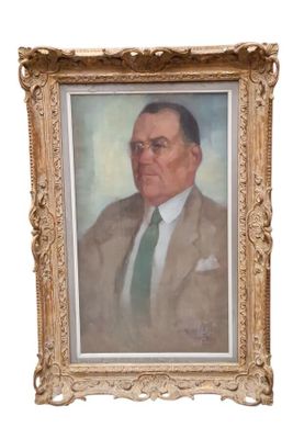 painting of a man in a suit and tie in a gold frame