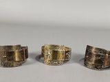 three different types of rings are shown on a table