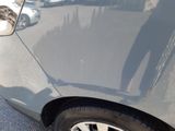 a close up of a car ' s tire on the street