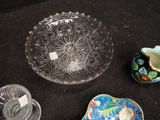 three bowls and a bowl on a black surface