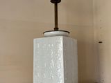 a lamp that is sitting on a shelf in a room