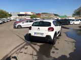 a lot of cars parked in a parking lot