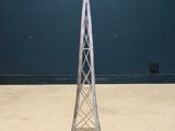 an image of a tall metal tower with a basket on top of it