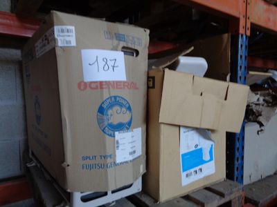 boxes are stacked on a pallet in a warehouse with a price tag on them