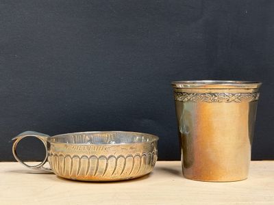 two cups sitting next to each other on a table