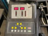 an image of a machine that is sitting in a garage