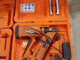 two orange boxes with tools in them sitting on the floor