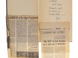 an old newspaper with a bunch of papers and a pen
