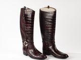 a pair of brown boots on a white background
