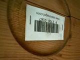 a close up of a wooden drawer with a barcode on it