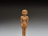 une figurine égyptienne en bois sculpté représentant une femme