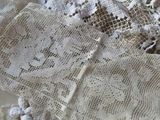 a close up of a table cloth with lace on it