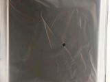 a white box with a black hole in it