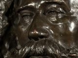 a close up of a statue of a man with a beard