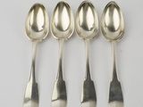 six spoons are lined up in a row on a white surface