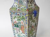 a vase that is sitting on a white surface
