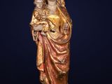 a statue of a woman holding a child in her arms