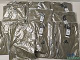 a lot of men ' s shirts wrapped in plastic