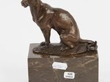 bronze sculpture of a cat on a marble base