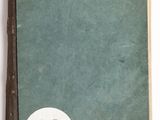 an old book with a number on it sitting on top of a table