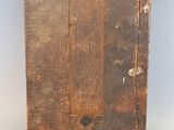 an old wooden picture frame with a brown strip of paint