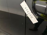a sticker attached to the side of a car door