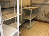 a room with shelves and a ladder in it